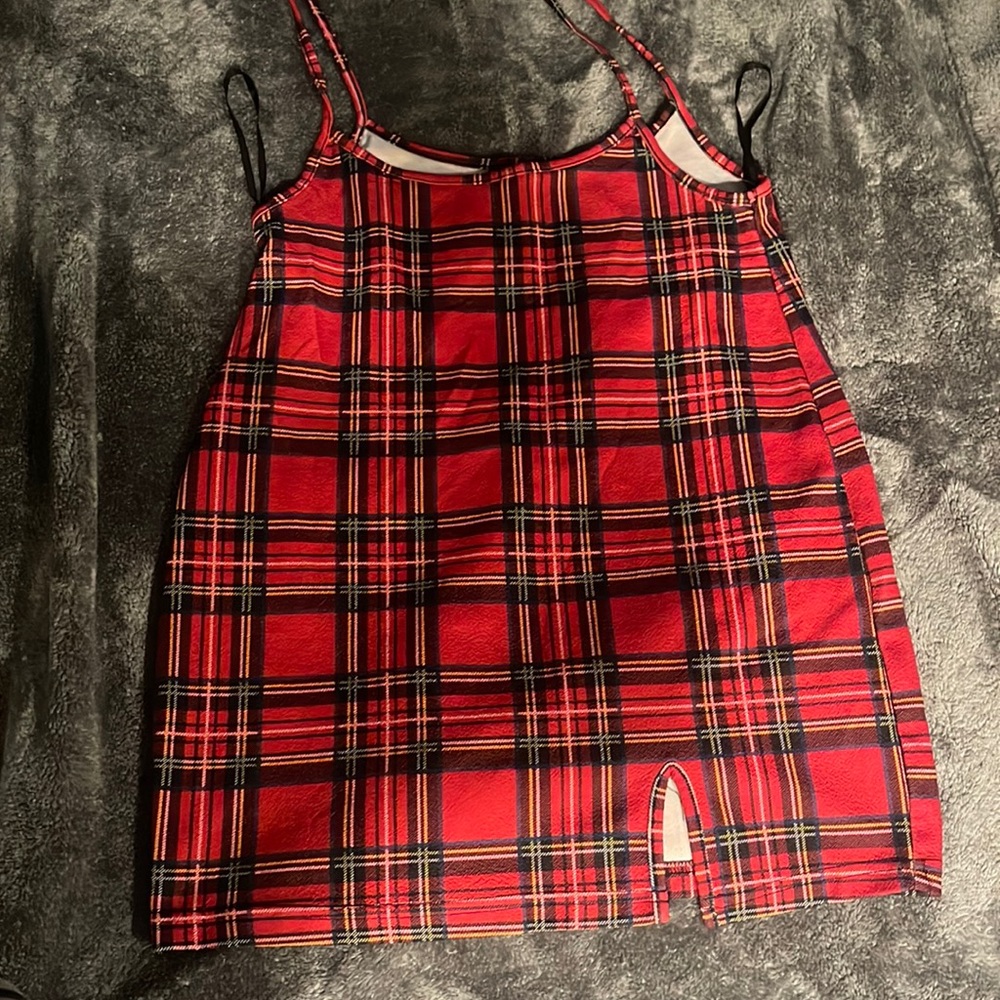 Red squared suspender skirt.